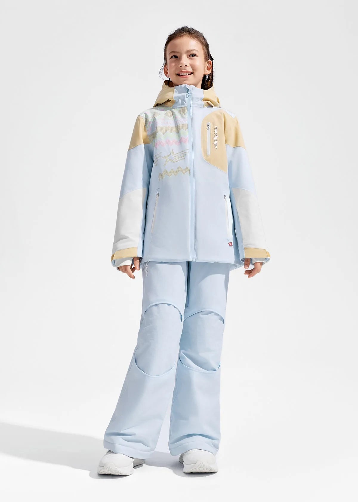 Close-up front view of pale blue and tan colour-block ski jacket with chest zip pocket and knitted-pattern graphic