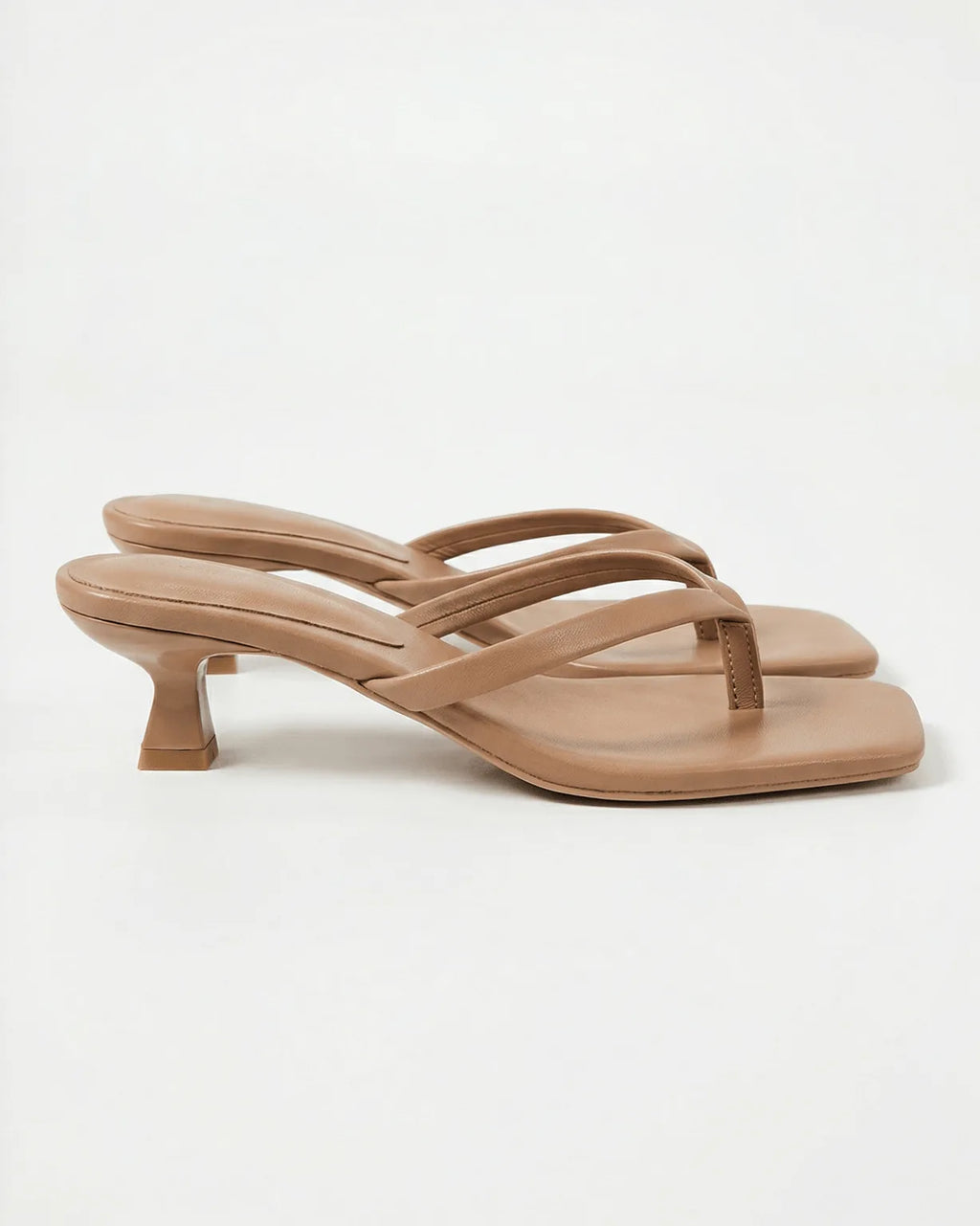 Taupe leather crossover strap sandal with low kitten heel and squared toe, side view