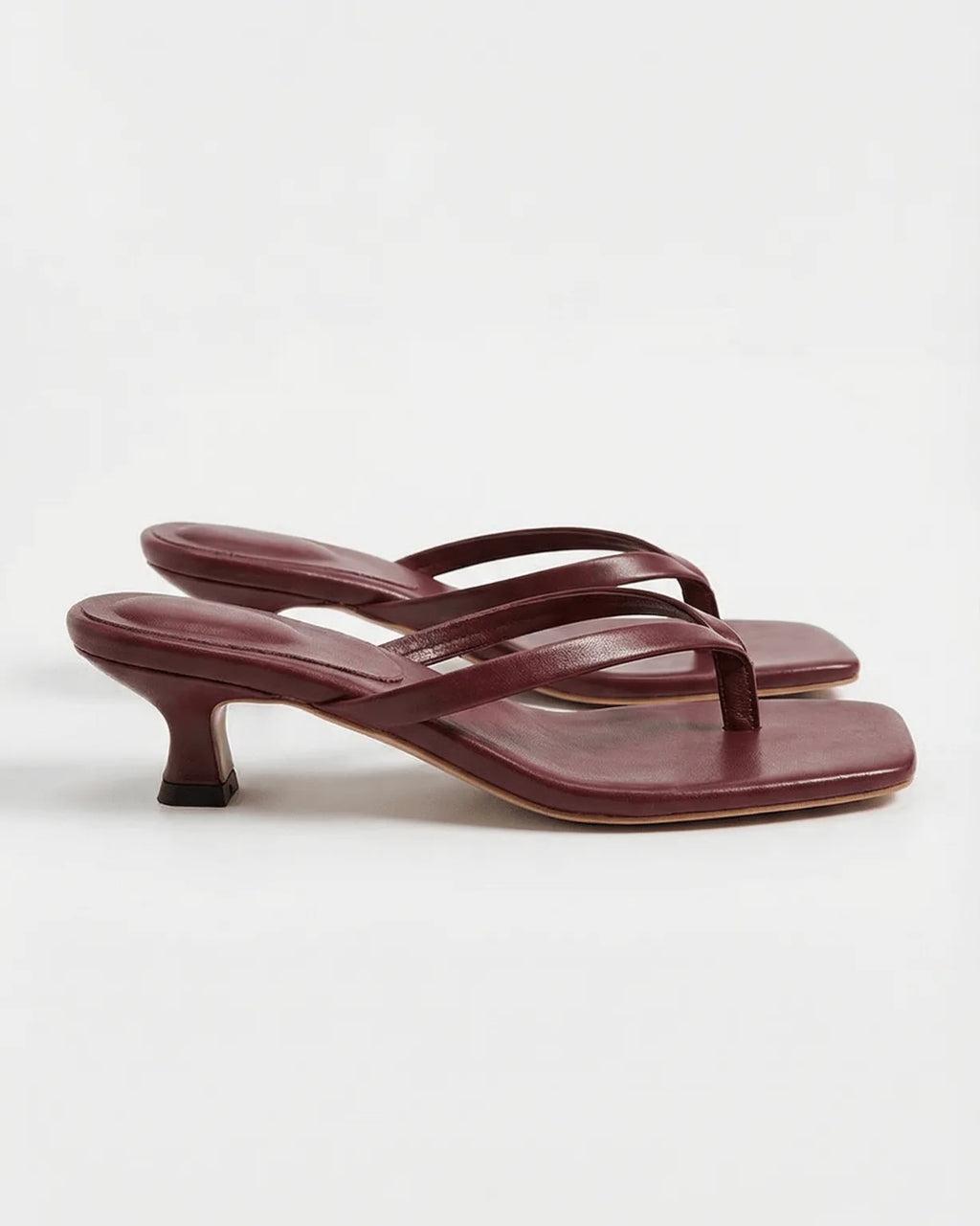 Burgundy leather square-toe sandal with thin crossover straps and low kitten heel, side view