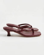 Burgundy leather square-toe sandal with thin crossover straps and low kitten heel, side view