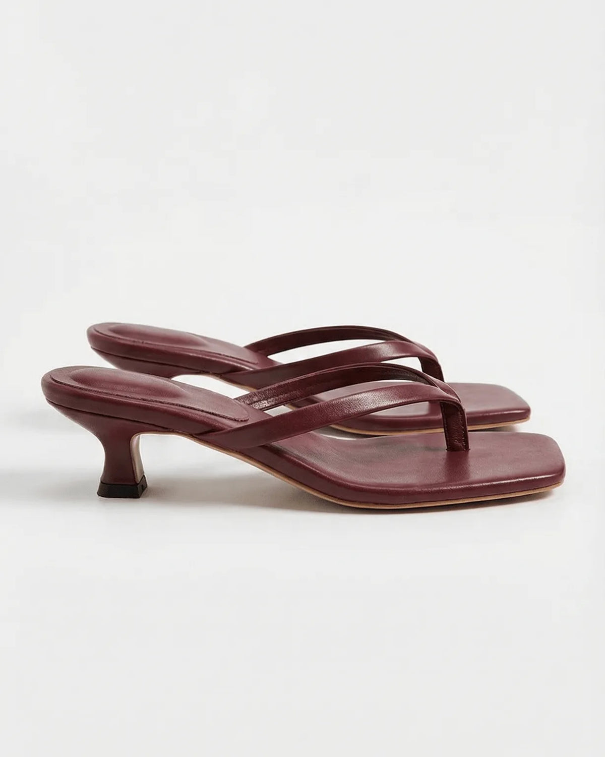 Burgundy leather square-toe sandal with thin crossover straps and low kitten heel, side view
