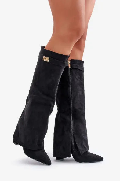 Side view of black suede knee-high flap boots showing pointed toe and block heel