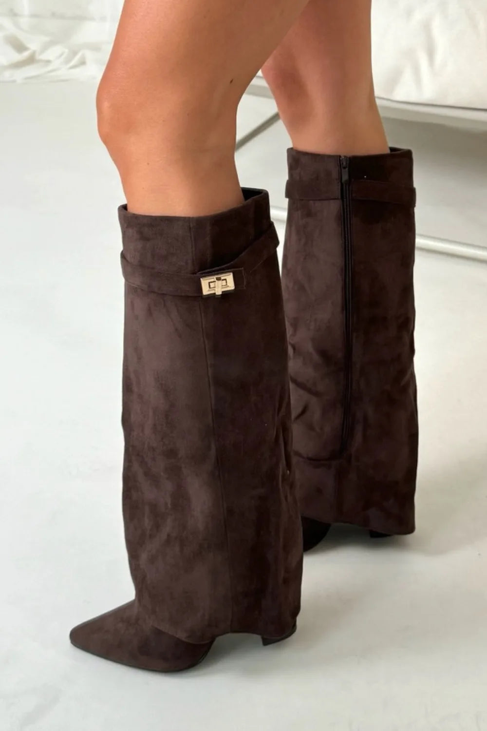 Front and back view of dark brown suede knee-high flap boots with gold buckle on cuff