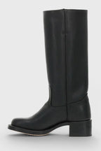 Pair of light brown leather knee-high boots photographed at a front angle on a white backdrop