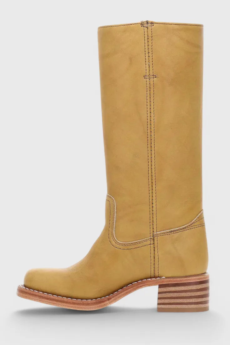 Close-up of the toe box and stitched seam on a black leather knee-high boot