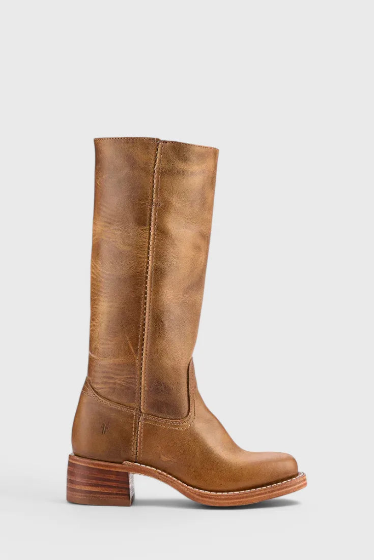 Front pair view of tan leather knee-high boots with visible grain texture and stitched detailing