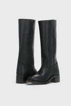Front pair view of black leather knee-high boots with a squared toe and chunky low heel