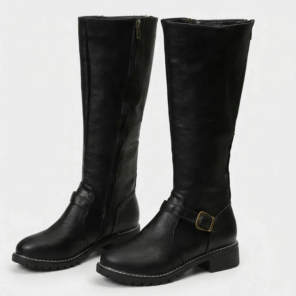 Black knee-high riding boots with visible side zip and ankle buckle strap, studio shot