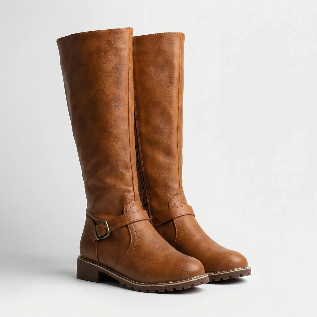 Pair of tan riding boots shown together from a side angle highlighting the stacked block heel