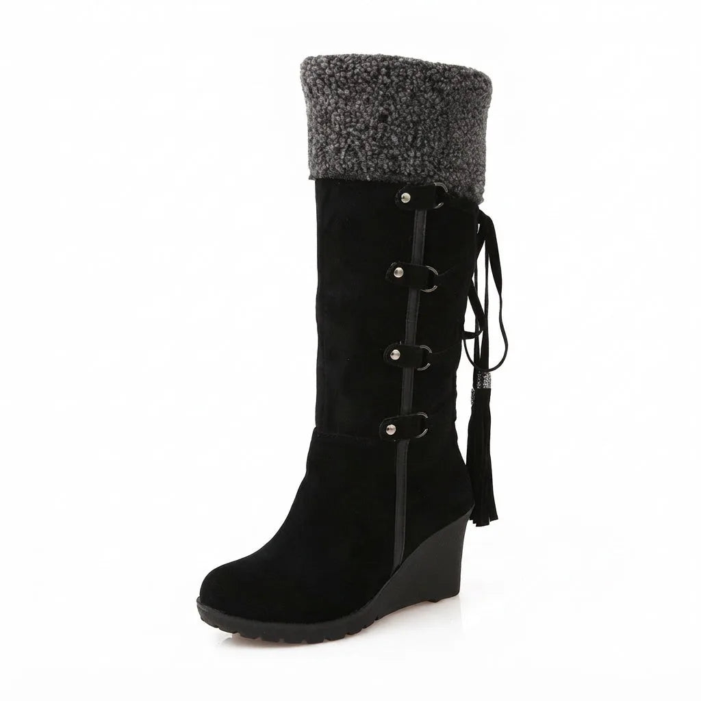 Side profile of black suede knee-high boot with grey knit-style cuff and buckle lacing
