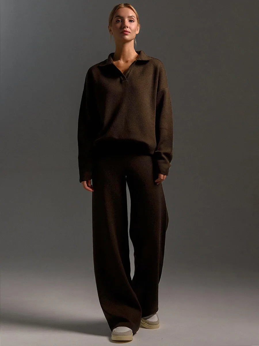 Front view of dark brown oversized polo jumper and wide leg knit trousers on a standing model