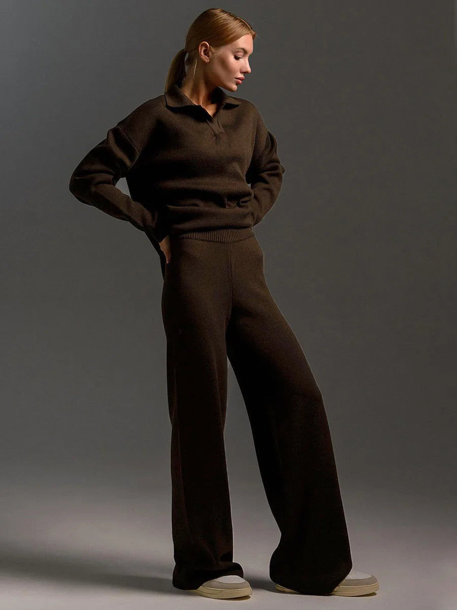 Close view of the ribbed collar and relaxed drop shoulder on the sand coloured knit polo jumper