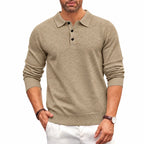 Front view of a beige knitted polo jumper with ribbed shirt collar and three-button placket, worn with white trousers