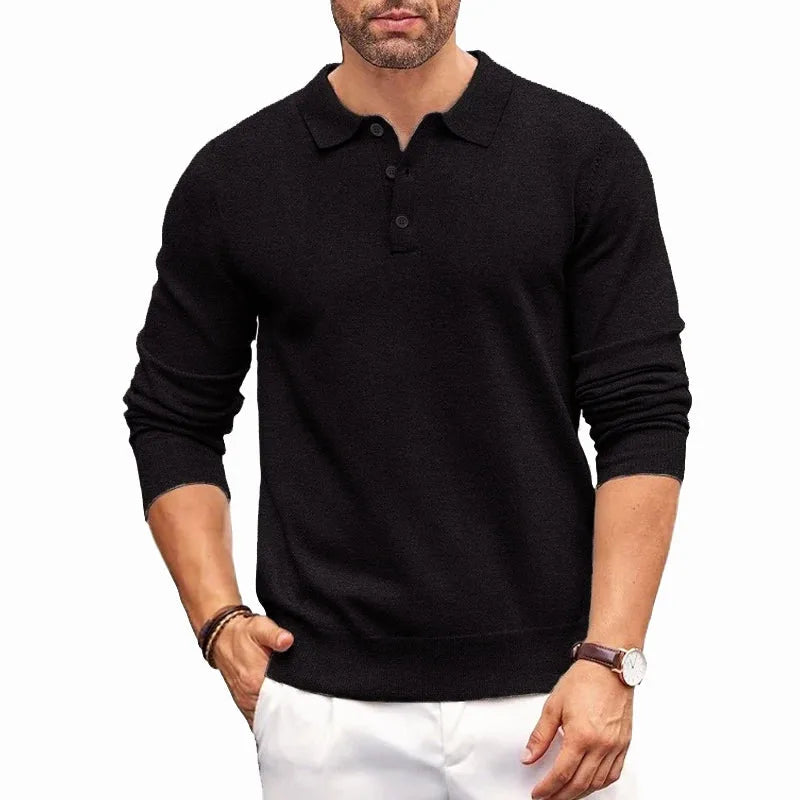 Black knitted polo jumper with shirt collar and button placket shown on a model from the chest down