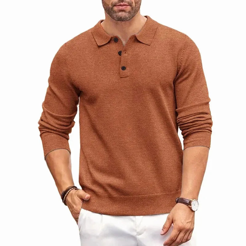Rust brown knitted polo jumper with collar and button placket worn casually with white trousers