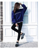 Close-up of the ribbed knit collar and air-cushion heel detail on a black sock-style trainer