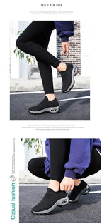 Pair of black knitted slip-on trainers shown together highlighting the platform sole and tread pattern