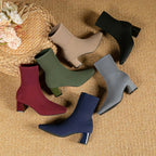 Five colourways of knit sock boots fanned out together, including beige, black, burgundy, grey and navy