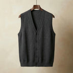 Dark grey knitted waistcoat with full button placket and ribbed armholes, shown hanging straight