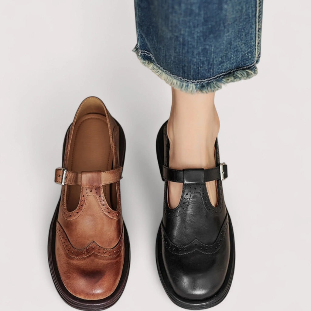 Overhead comparison of the brown and black leather Mary Jane shoes side by side, worn and unworn