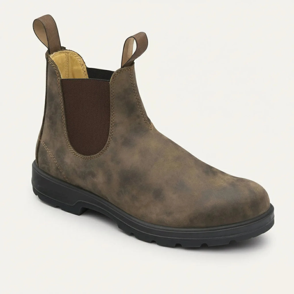 Three-quarter view of a rustic brown leather Chelsea boot with elastic side panel and chunky black sole