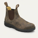 Three-quarter view of a rustic brown leather Chelsea boot with elastic side panel and chunky black sole