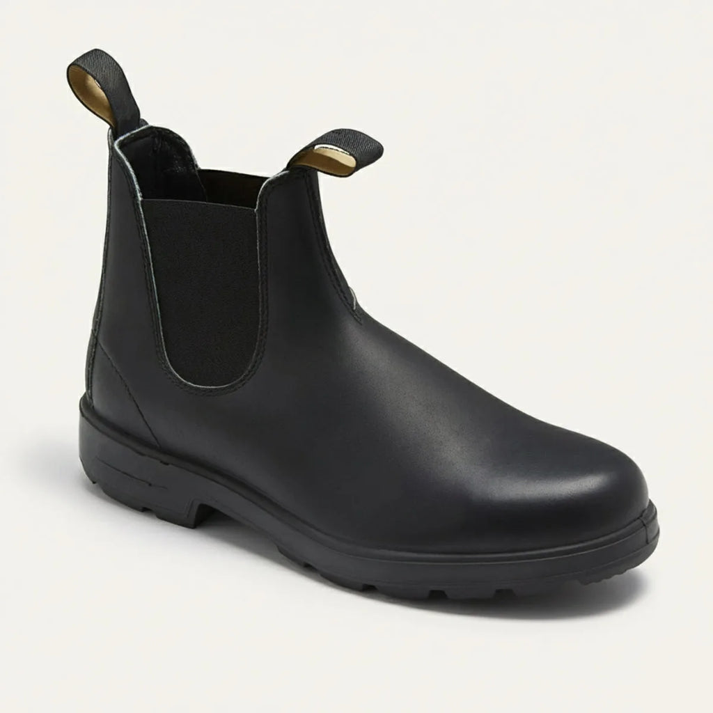 Three-quarter view of a smooth black leather Chelsea boot with elastic panel and pull tabs