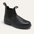 Three-quarter view of a smooth black leather Chelsea boot with elastic panel and pull tabs