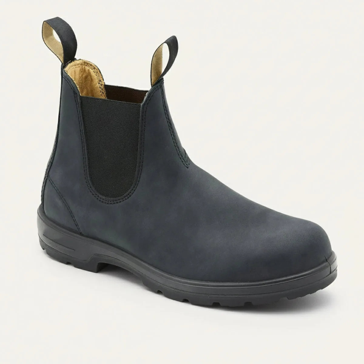 Three-quarter view of a matte black leather Chelsea boot with round toe and black sole