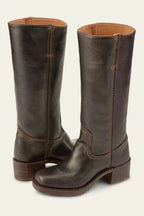 Close-up of the ankle seam and pull tab detail on a tan brown leather boot