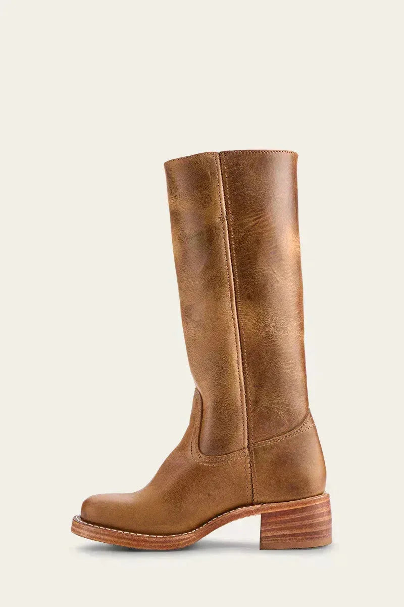 Pair of tan brown leather boots arranged together showing both the front and side profile