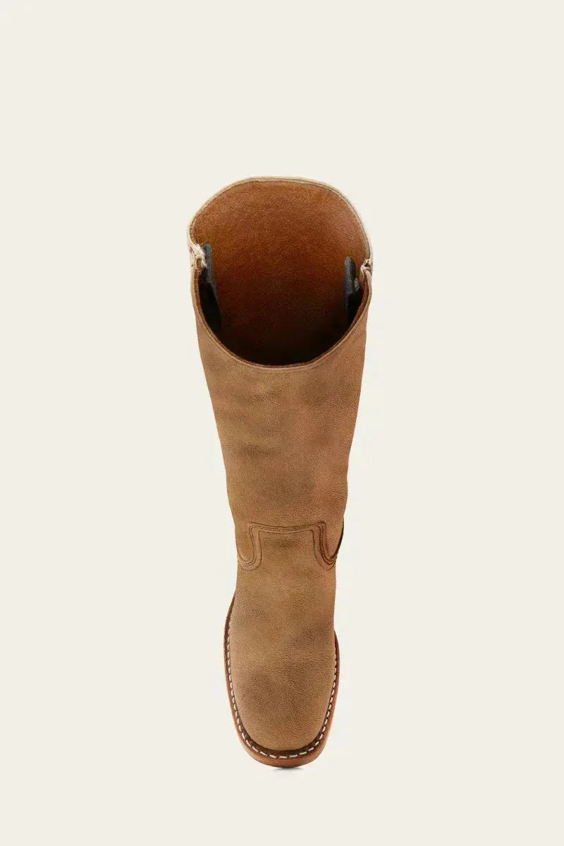 Close-up of the leather grain and vertical seam on a khaki-toned leather boot shaft