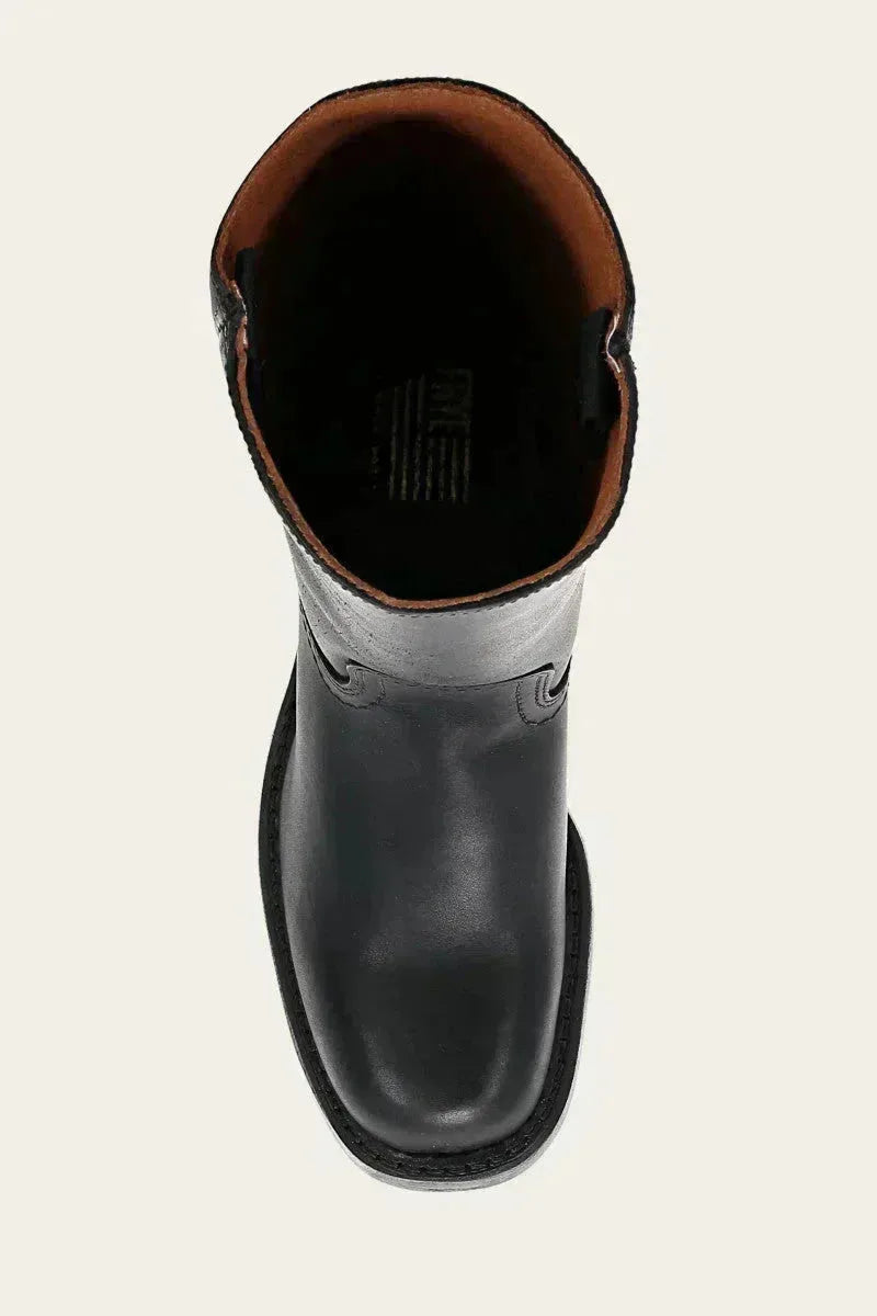 Sole view of a tan brown leather boot showing the stitched leather outsole and toe shape