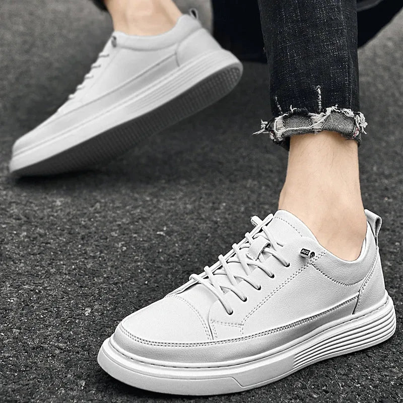 Black leather trainer displayed at an angle showing the full lace-up front and toe shape
