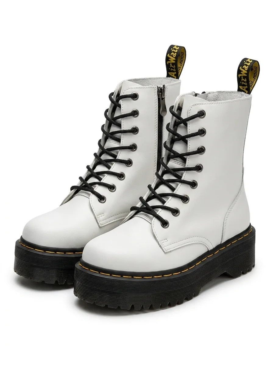 Pair of white leather lace-up ankle boots shown together, front three-quarter view with yellow stitching detail