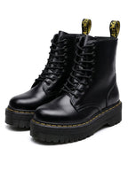Pair of black leather lace-up boots shown together against white background, highlighting round toe and chunky sole