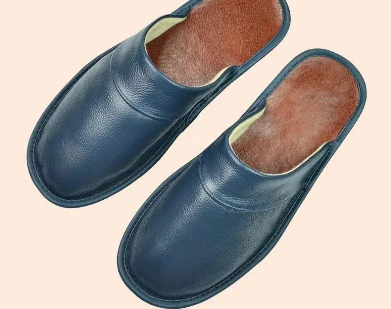 Detail shot of the rounded heel edge and stitched border on a brown leather slipper