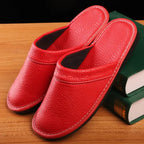 Close-up angle of brown leather slipper toe showing creased grain texture and padded sole edge