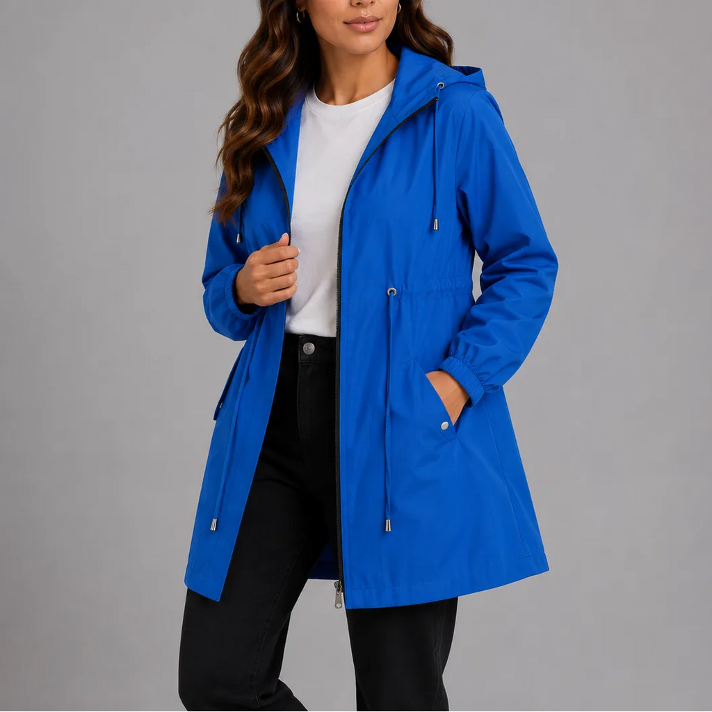 Bright blue hooded rain coat with hand tucked in the side pocket, showing the relaxed regular fit and hood.