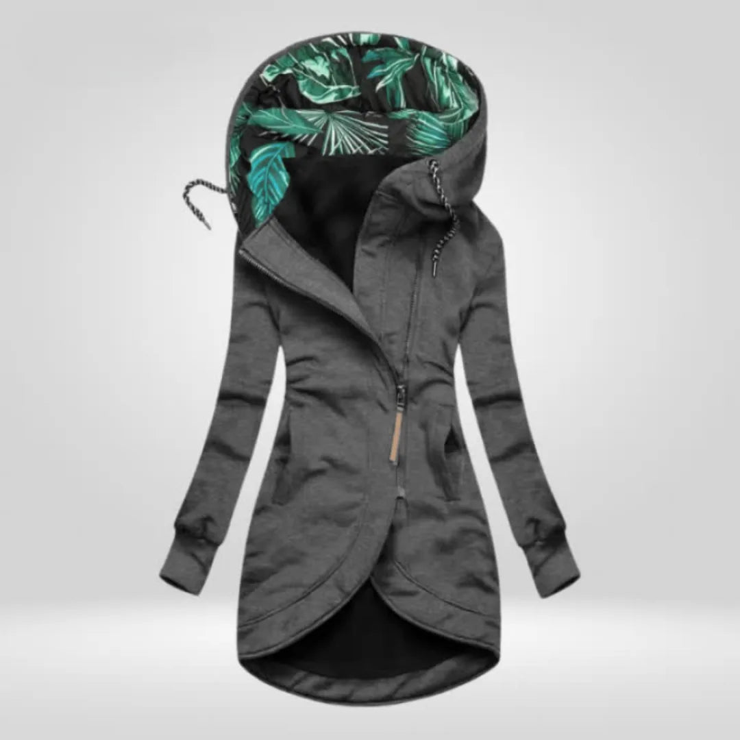 Charcoal grey zip-up hooded coat showing tropical leaf print hood lining and curved hem