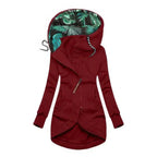 Red longline hooded jacket with green leaf-print hood lining and asymmetric zip front
