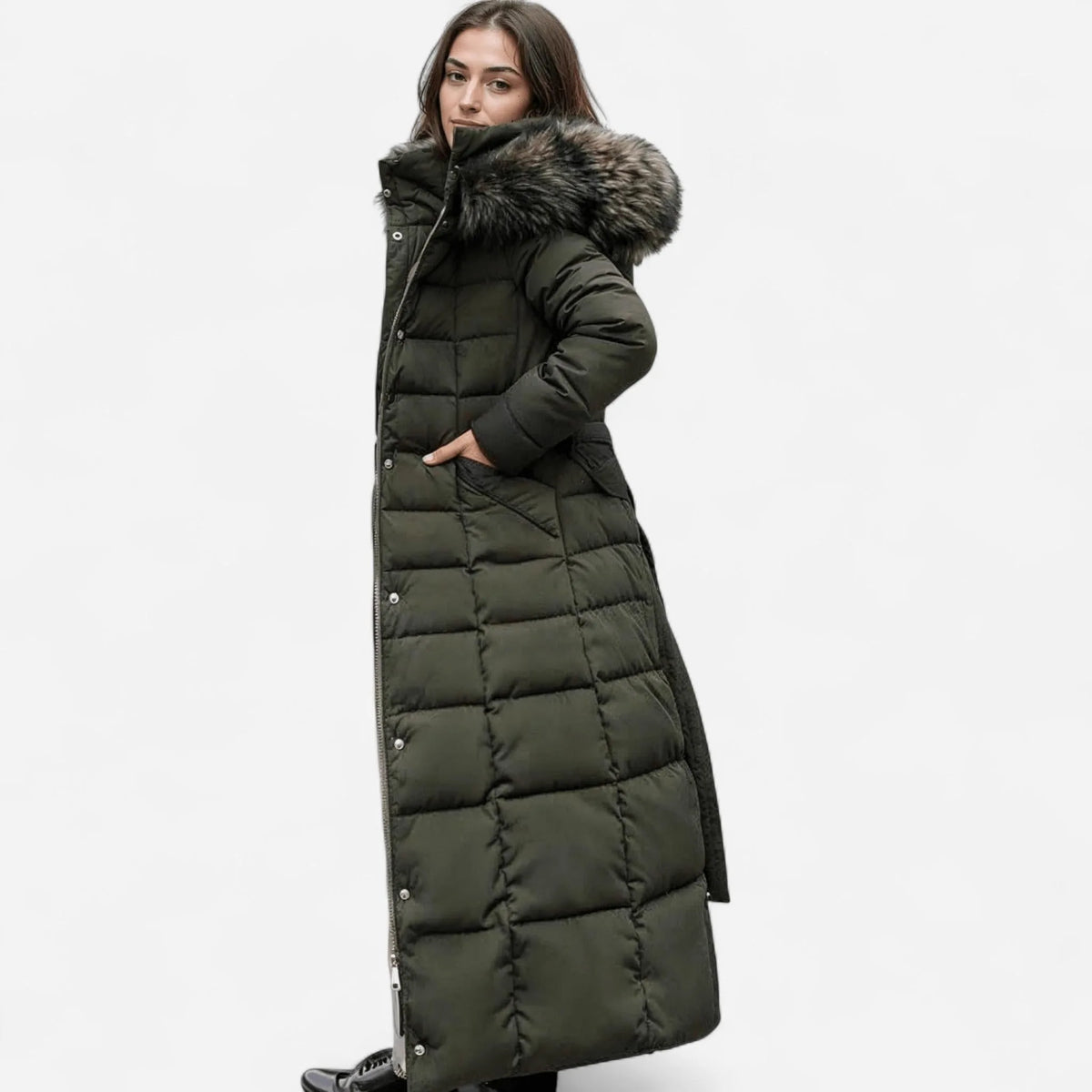 Side profile of an olive green longline puffer coat with grey fur-trimmed hood and side pockets