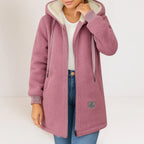 Dusty pink sherpa fleece hooded jacket with ribbed cuffs and drawstring hood, worn open over a white top