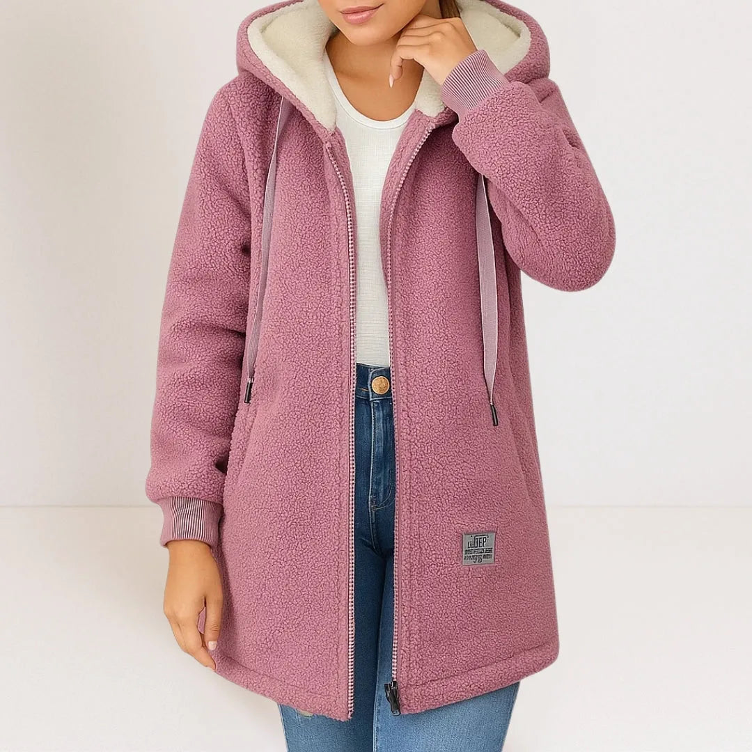Dusty pink sherpa fleece hooded jacket with ribbed cuffs and drawstring hood, worn open over a white top