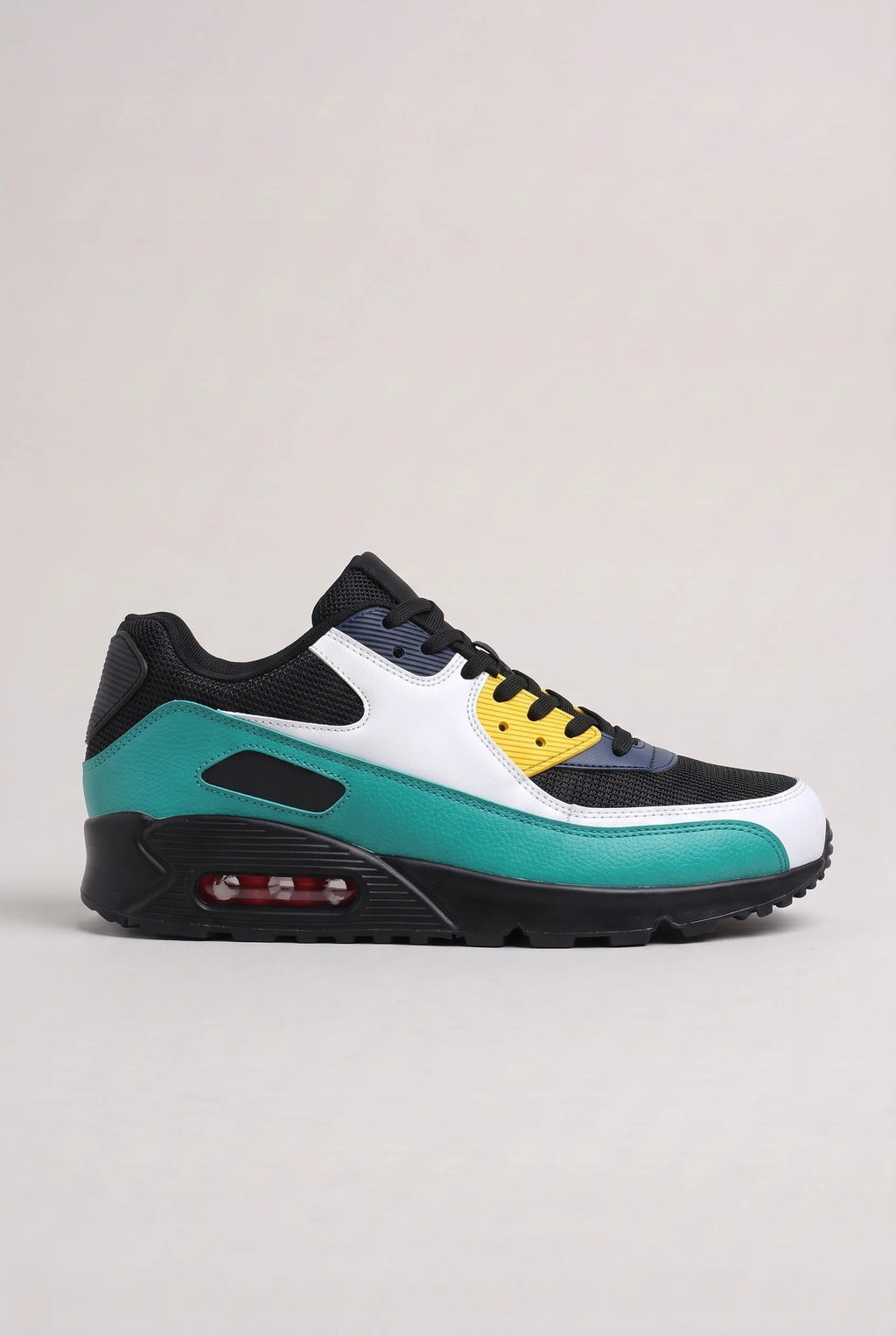 Side view of black, white, teal and yellow colour-block mesh trainer with visible air-cushioned sole unit