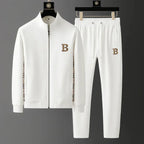 White full-zip tracksuit set on hangers, front view showing checked panel detail and drawstring joggers