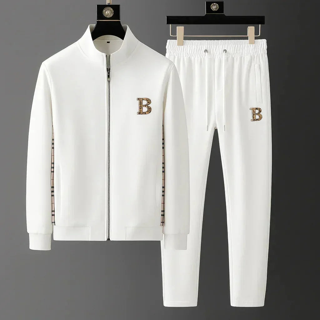 White full-zip tracksuit set on hangers, front view showing checked panel detail and drawstring joggers