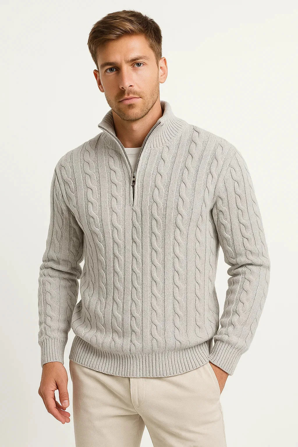 Light grey cable-knit quarter-zip jumper styled with cream trousers, shown from the front