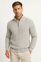 Light grey cable-knit quarter-zip jumper styled with cream trousers, shown from the front