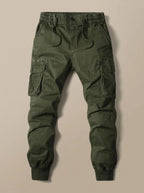 Flat lay of olive green cargo joggers with zip and button cargo pockets and elastic cuffed hems